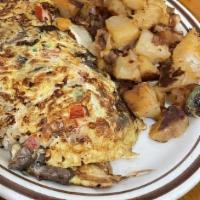 Vegetarian Omelette · With fresh mushrooms, onions, peppers and tomatoes.