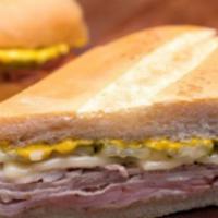 Cuban Sandwich · Pernil, ham, Swiss cheese, pickles and mustard.