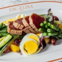 Niçoise Salad · Fresh tuna, hard-boiled eggs, tomato, green beans, red onion, olives, anchovies.
