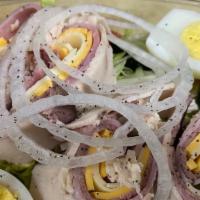 Chef Salad · Romaine, Roast Beef, Turkey, Ham, American Cheese, Chopped Eggs, Cucumbers & Tomatoes