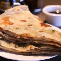 Scallion Pancake · scallion pancake, is a Chinese, savory, unleavened flatbread folded with oil and minced scal...