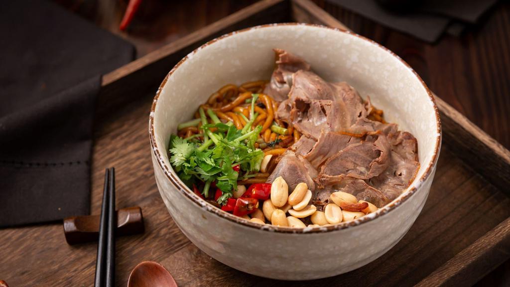Braised Rice Noodles · Contains sliced beef,cilantro,peanuts and hot red peppers.