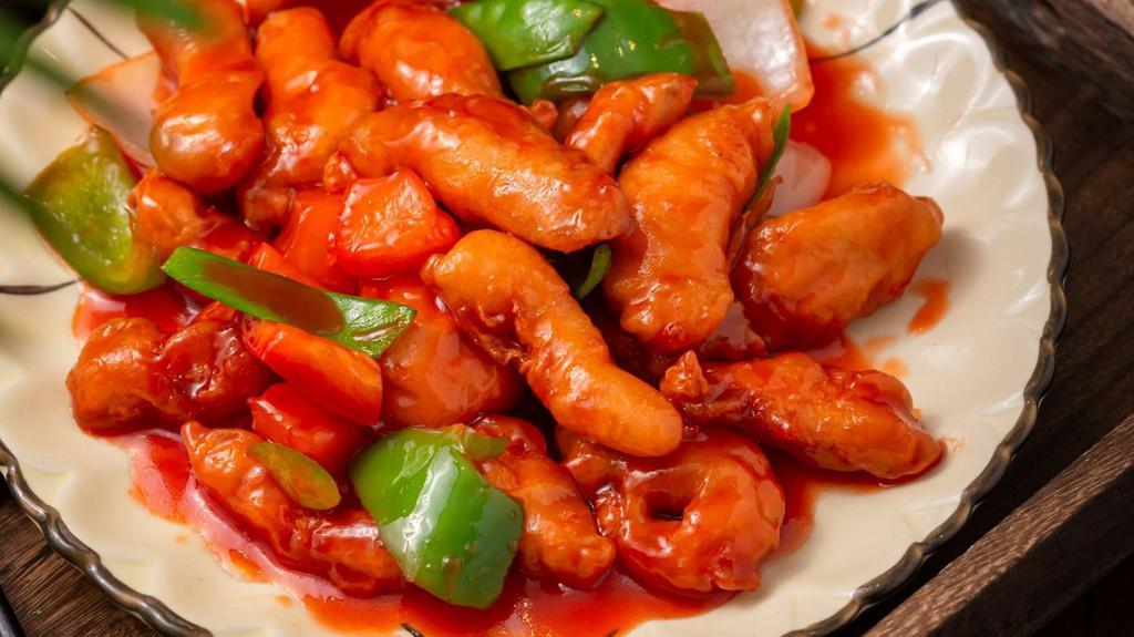 Sweet & Sour Chicken · deep fried chunk white meat and onion, snow peas, pineapple, carrot w. sweet sour sauce (separate sauce)