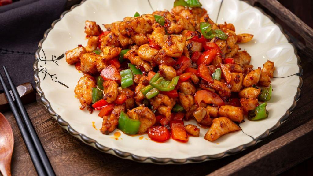 Stir Fried Chicken W. Roasted Chili Peanuts · sauteed diced white meat and diced spicy green pepper, red pepper, water chestnuts, peanuts w. spicy brown sauce
