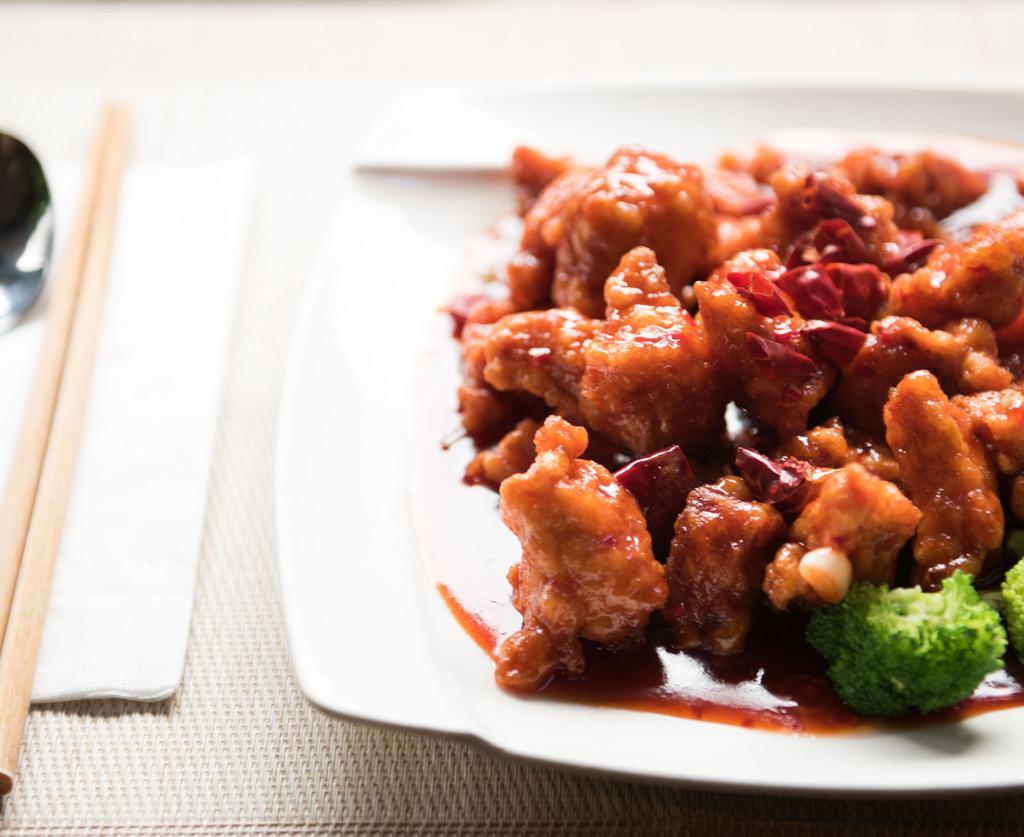 Tangerine Chicken · deep fried chunk white meat and a few steamed broccoli, orange peel w. sweet sour spicy sauce