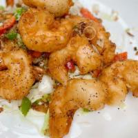 Jumbo Shrimps W. Salted Pepper · fried prawns and onion w. salted pepper