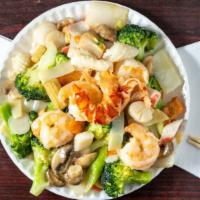 Seafood Delight · Lobster, sea scallop, jumbo shrimp and crab meat sauteed with mixed vegetables in white sauc...