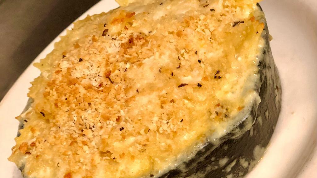 Mac N' Cheese · bowtie pasta in the cheesiest of cheese sauces topped with a toasted panko crust