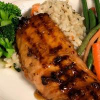 Fresh Grilled Salmon · fresh grilled salmon sauced with an orange ginger glaze served with fresh vegetables and ris...
