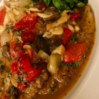 Chicken Orvieto · lightly breaded chicken sauteed with artichokes, mushrooms, roasted red peppers and pancetta...