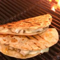 Grilled Jerk Chicken Quesadilla · grilled jerk chicken and cheddar cheese press grilled in flour tortilla triangles