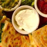 Pesto & Goat Cheese Quesadilla · pesto, spinach, roasted peppers and goat cheese and cheddar cheese press grilled in flour to...