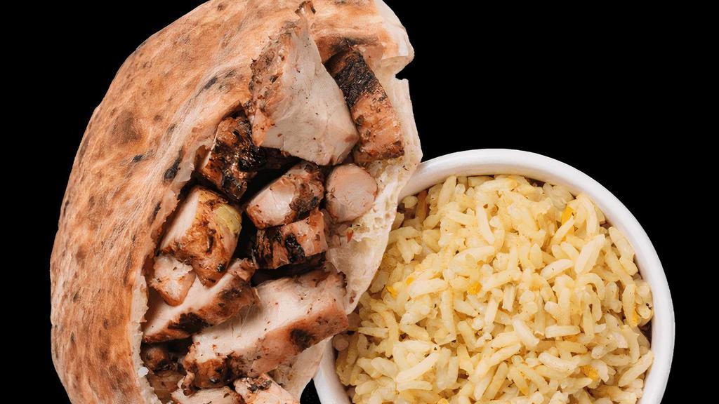 Clucky Mccluckerson · Chicken pita with saffron rice, chicken rōti, and choice of sauce