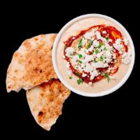 Spicy Feta Hummus With Pita · Creamy hummus made from fresh chickpeas, garnished with our spicy Red S'hug sauce, feta, and...