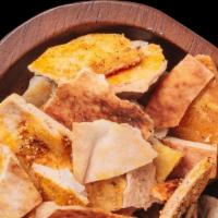 Pita Chips · House-baked pita chips covered in our signature Mediterranean spices