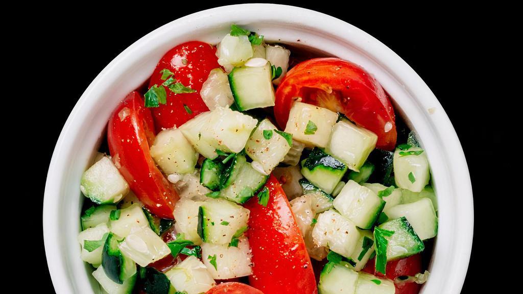 Tomato & Cucumber · Our take on the classic Jerusalem Salad. Fresh tomatoes and cucumbers, diced and tossed in olive oil and lemon juice