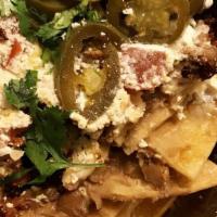 Chorizo Nachos · Mexican sausage. Nachos with beans, shredded cheese, cream, jalapeno, tomato, cilantro and o...