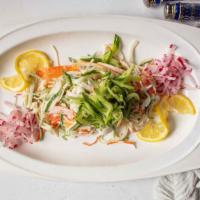Japanese Kani Salad · Chopped Japanese imitation crab meat and cucumbers tossed with mayonnaise.