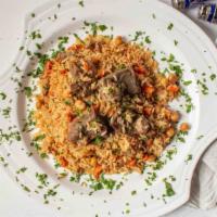 Uzbek Pilaf With Lamb Meat · Rice, carrots, reasons, chickpeas, meat and eastern species.