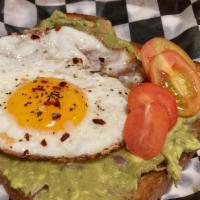 Avocado Toast · Mashed avocado over toasted challa bread, topped with  crispy sunny side up egg