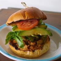 Codfish Sandwich · Saltfish Stewed in Sòs with Watercress, Fresh Tomato, and Cucumber on a Roll