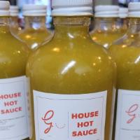 House Hot Sauce  (8 Ounce) · House Recipe Scotch Bonnet Peppers, Vinegar, Garlic, Sweet Peppers, Onions, and Spices