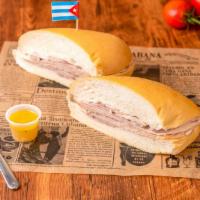 Pan Con Lechón / Bread With Pork · En nuestros rolos cubanos (sin tostar), con cerdo asado (marinado durante la noche, asado en...