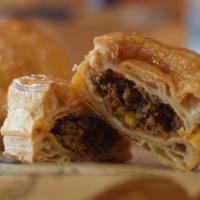 Meat Pastry / Pastelito De Carne · Filled with ground beef w/ raisins & olives.