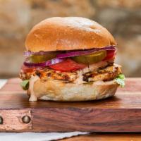 Grilled Chicken Burger · Boneless grilled or fried chicken with lettuce, tomato, onion, pickles, sauce served  on a b...