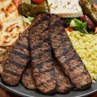 Lamb Gyro · Six pieces of juicy lamb gyro served with Greek salad and yellow rice or fries. The platter ...