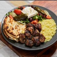Pork Souvlaki · Ten to twelve pieces marinated pork chunks served with Greek salad and rice or fries. The pl...
