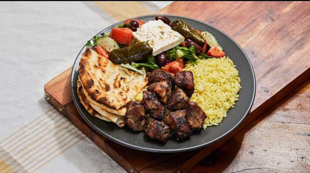 Pork Souvlaki · Ten to twelve pieces marinated pork chunks served with Greek salad and rice or fries. The platter comes with a side pita bread and our homemade white sauce (tzatziki).