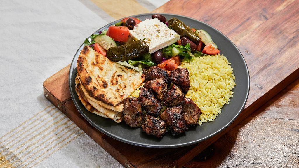 Pork Souvlaki  Platter · Ten to twelve pieces marinated pork chunks served with Greek salad and rice or fries. The platter comes with a side pita bread and our homemade white sauce (tzatziki).