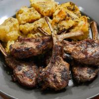 Lamb Chops · Five pieces of tasty, juicy lamp chops with a side pita bread and A1 steak sauce.