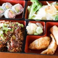 Beef Bento · Bento box featuring your choice of teriyaki comes with four pieces of California roll, Two p...