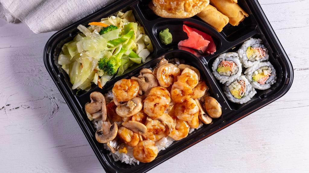 Shrimp Bento · Bento box featuring your choice of teriyaki comes with four pieces of California roll, two pieces of chicken dumpling, two pieces of spring roll. Choose two sides white rice, fried rice, noodles, and mixed vegetables.