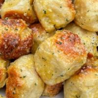 Garlic Knots · Rolled baked garlic bread.