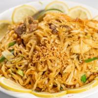 Pad Thai · Stir-fried Thai noodles with chicken or shrimp, egg, bean sprouts, dry tofu & topped with gr...