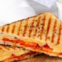 Grilled Cheese With Tomato · Your Choice of Cheese And Sliced  Tomato between two slices of bread, heated until the bread...