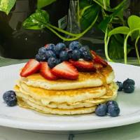 Pancakes · Topped with mixed berries and Maple syrup.