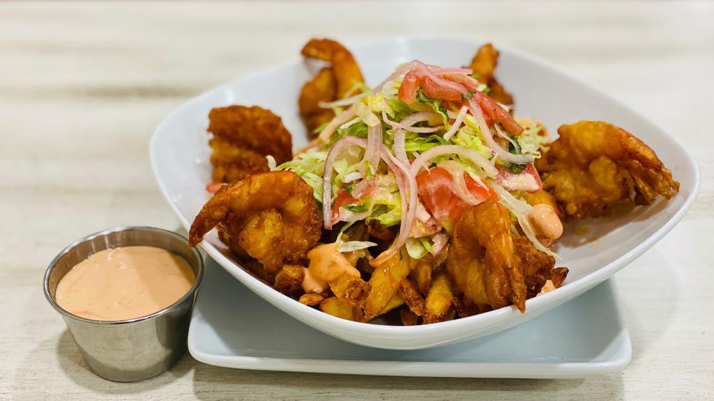 Shrimp & Fries  · Fried shrimp with fries served with pink sauce.
