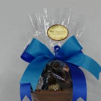 Cc-.075 · Edible chocolate basket containing 10-12 truffles and assorted chocolate pieces.

Net weight...