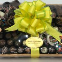 C-103 · Our Signature Chocolate Baskets are filled with an assortment of mouth watering gourmet asso...