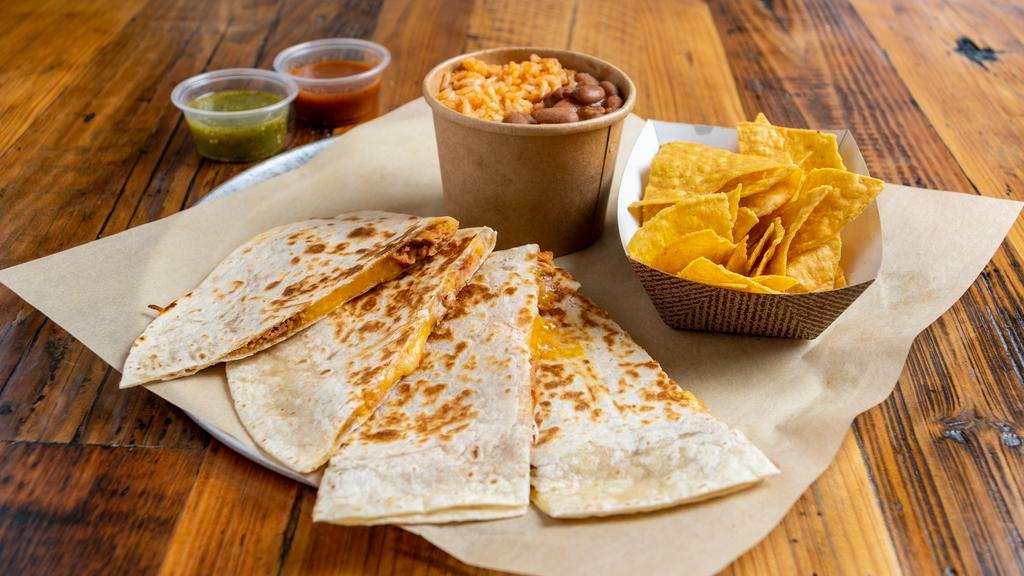 Quesadilla · Soft flour tortilla filled with your choice of meat and cheese, served with a side of rice and beans.