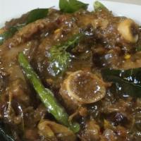 Gongura Goat Curry · Baby goat cooked with fresh gongura and spices. Served with Basmati rice.