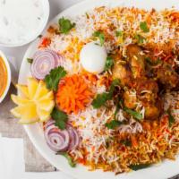 Chicken Dum Biryani · Tender chicken and special basmati rice flavored with authentic spices and cooked on a slow ...