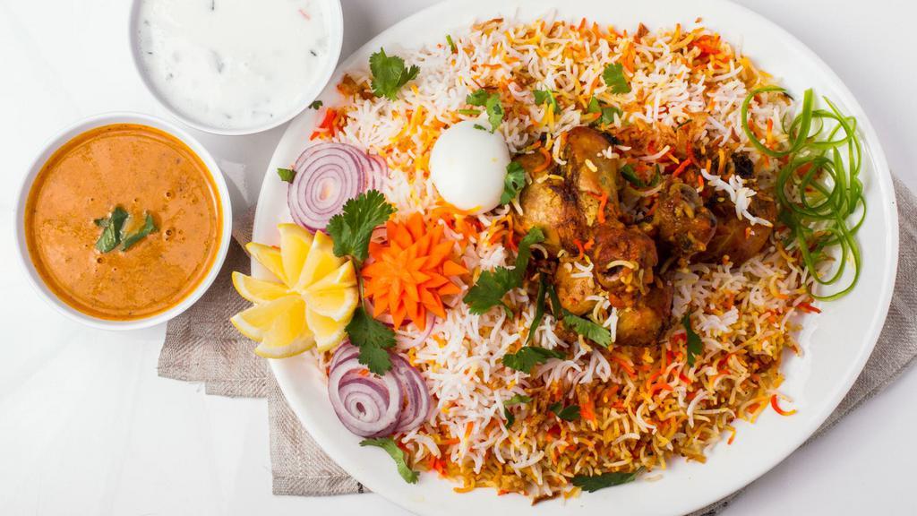 Chicken Dum Biryani · Tender chicken and special basmati rice flavored with authentic spices and cooked on a slow flame.