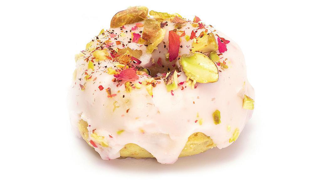 Pistachio Rose · Toasted pistachio donut with delicately flavored rose water glaze, topped with crushed rose petals and more pistachios.
