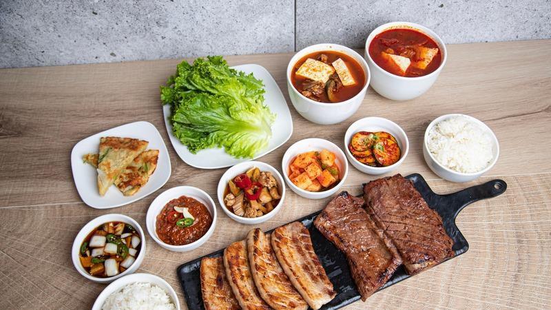 Dinner For Four · Includes 
- 1 corn cheese plate
- 4 assorted banchan (in 12oz container)
- Ssamjang (spicy Korean miso paste)
- Baekjeong house dipping sauce (in 16oz container), 
- Ssam,(8 pcs of lettuce wraps)
- 4 pints of white rice