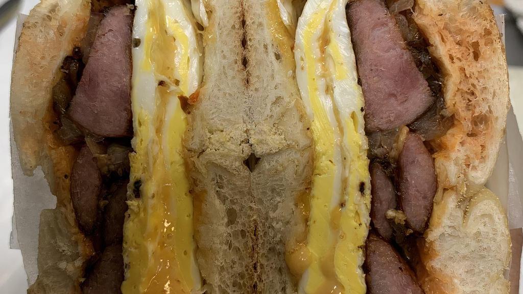  Kielbasa Special  · 2 eggs, grilled kielbasa, grilled onions, melted pepper colby jack cheese, salt, pepper, and hot sauce.